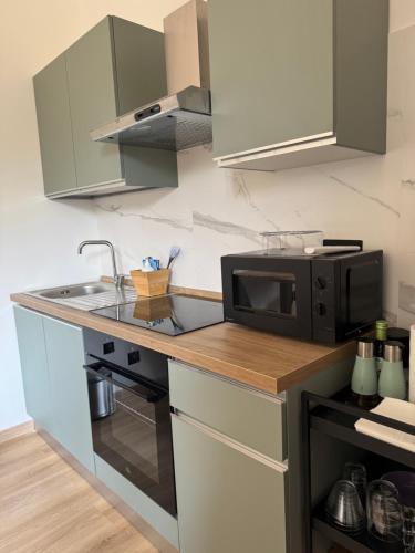 Kuchyň nebo kuchyňský kout v ubytování Casa Botanya - Rooms