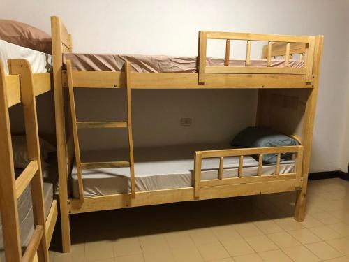a couple of bunk beds in a room at Frida Hostel in Encarnación