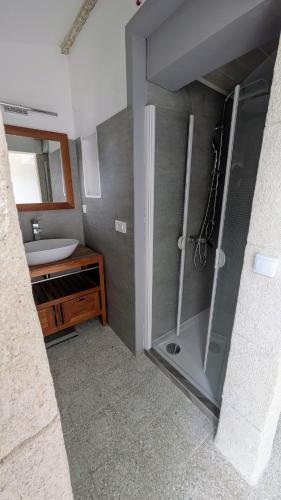 a bathroom with a shower and a sink at Rez de jardin chez Elise in Saint-Christol-lès-Alès