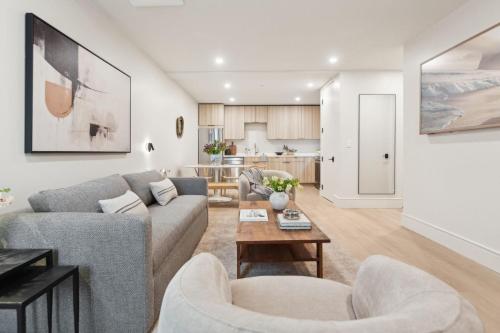 a living room with a couch and chairs and a table at Casa Riviera - Boutique Apartments in Downtown Santa Barbara in Santa Barbara