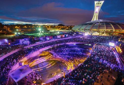 a crowd of people at a stadium at night at LiV MTL Main in Montréal