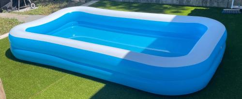 a blue pool on the grass in a yard at La Belle Noiera in Bretenoux