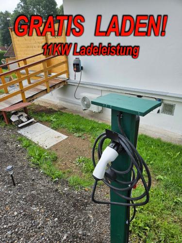 a camera on a pole next to a building at Wellness Apartment 