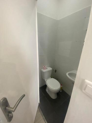 a small bathroom with a toilet and a sink at LaVIVA 1er in Calais