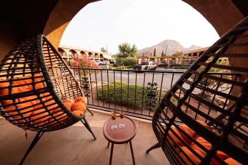 two hammocks on a balcony with a view of a street at GreenTree Inn Sedona in Sedona