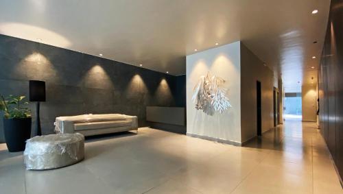 a large lobby with a large painting on the wall at Rincón de Barrio Sur in San Miguel de Tucumán