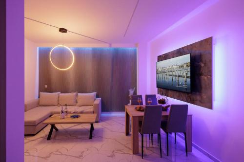 a living room with a couch and a table at Urban Energy Suites in Heraklion