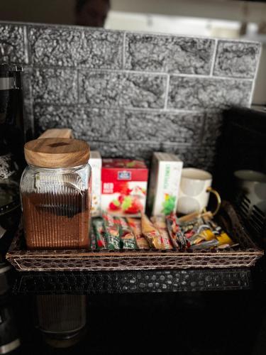 a shelf with food and other items on it at Domatio Apartments in Novi Pazar