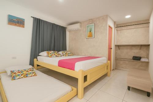 a bedroom with two beds in a room at Taybo House by St Hoteles in San Andrés