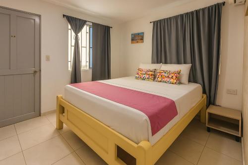 a bedroom with a large bed in a room at Taybo House by St Hoteles in San Andrés
