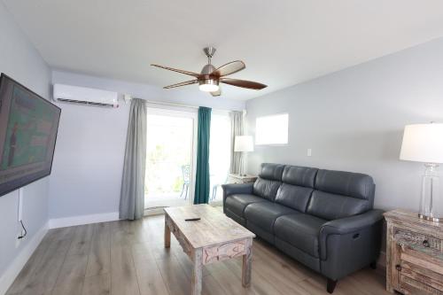 a living room with a couch and a table at The Inn on Siesta Key in Siesta Key