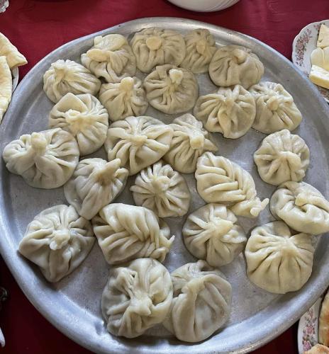 a pan of uncooked dumplings on a table at Tazos Winery guest house in Abasha