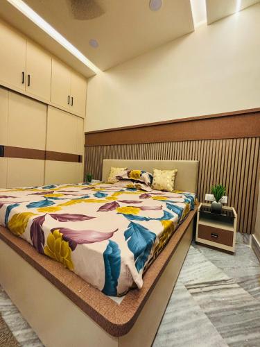 a bedroom with a large bed in a room at DeeHa Niwas - A Banarasi Home in Varanasi