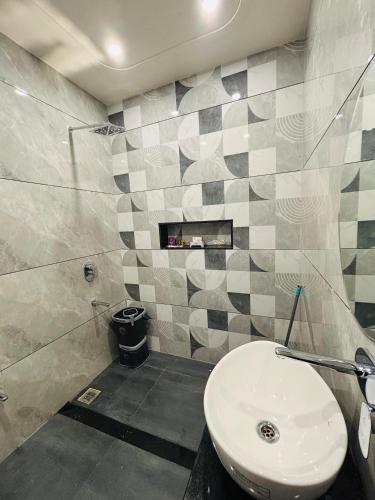 a bathroom with a toilet and a sink at DeeHa Niwas - A Banarasi Home in Varanasi