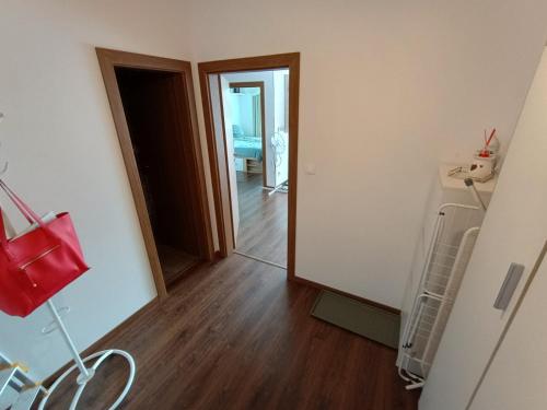 an empty room with a hallway with a mirror at Maison de Veve in Svätý Michal
