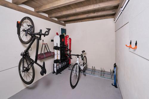 a bike hanging on a wall in a garage at Chalupy Raz Dva in Roprachtice