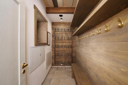 a hallway with wood paneling and a wooden wall at Chalupy Raz Dva in Roprachtice