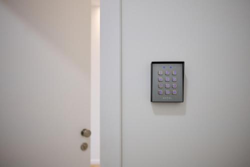 an open door with a remote control on it at Apartment La Barrière 6 in Brussels