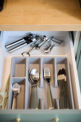 a drawer filled with utensils and silverware at Apartment La Barrière 6 in Brussels