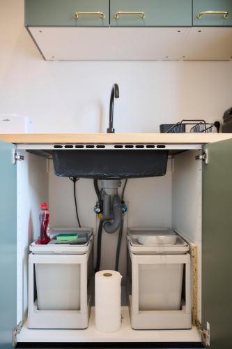 a sink and two toilets under a counter at Apartment La Barrière 6 in Brussels