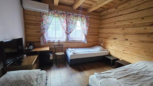 Postel nebo postele na pokoji v ubytování Wyspa Kampinos