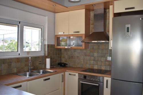 Η κουζίνα ή μικρή κουζίνα στο Chalou Stay - Comfort Near Airport