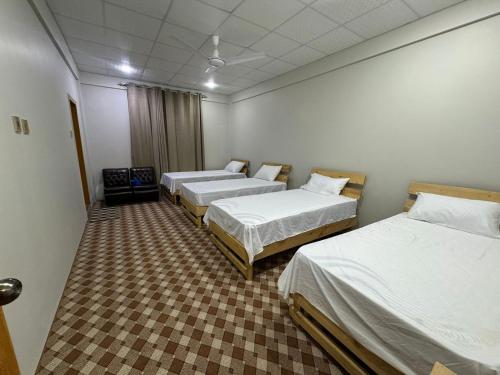 The Galaxy Inn Hotel Nagar Hunzaにあるベッド