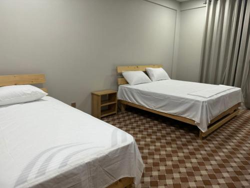 The Galaxy Inn Hotel Nagar Hunzaにあるベッド