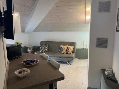 a living room with a couch and a table at Lucciano Suite in Quarrata