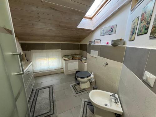 a small bathroom with a toilet and a sink at Lucciano Suite in Quarrata