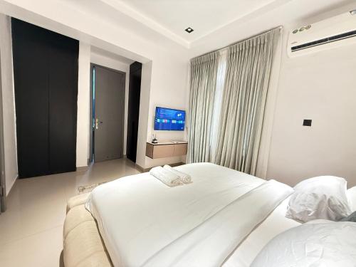 Ένα ή περισσότερα κρεβάτια σε δωμάτιο στο MEX APARTMENTs Parkview ikoyi