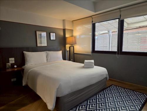 Кровать или кровати в номере Somewhere to Escape - Hometel