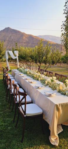a long table set up for a dinner party at GreenField Resort in Yeghegnadzor