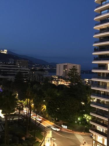 a city skyline at night with a tall building at Heart of Monte Carlo - 1 Min from the F1 Track in Monte Carlo