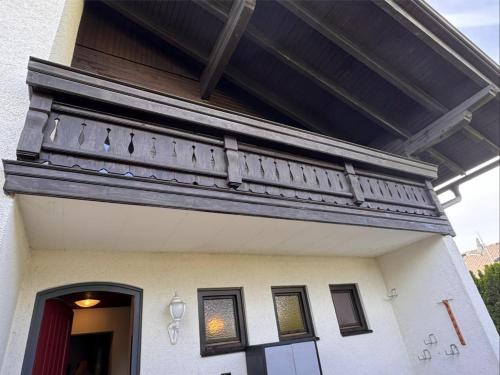 a balcony on the side of a house at Luxury 4BR Villa Velden Pool Grill in Velden am Wörthersee