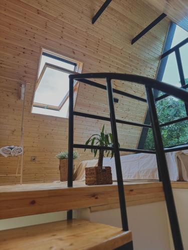 a room with a bed and a window at Utopia Inn უტოპია ინნ in Batumi