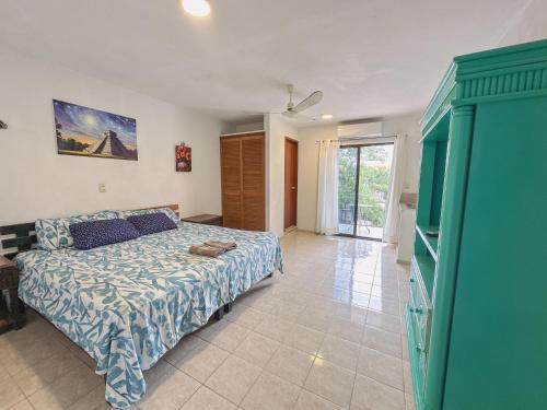a bedroom with a bed and a room with a window at Casa Santa María Valladolid in Valladolid