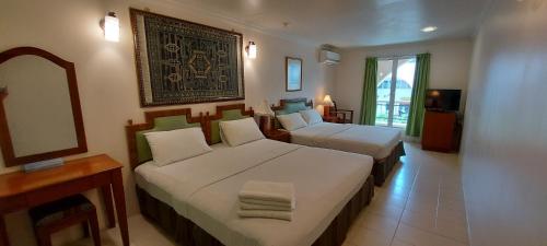 Katil atau katil-katil dalam bilik di Hotel Johan