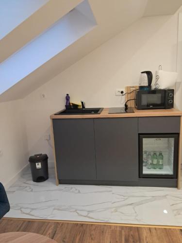 a kitchen with a counter with a microwave on it at Galija in Tomislavgrad