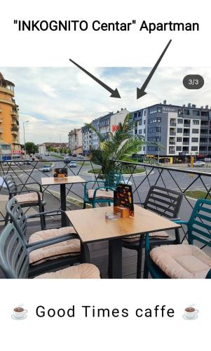 a photo of two tables and chairs on a balcony at "INKOGNITO Centar" Apartman in Brčko