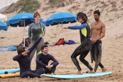 a group of people standing on a beach at Balance Surf Morocco , Quality rooms , Moroccan food , Activities in Aourir