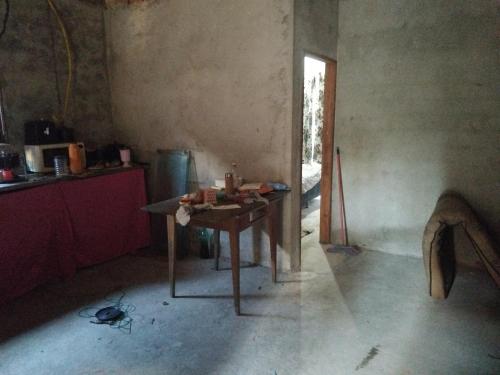 a room with a table in the corner of a room at Espaço de bronze in Belém