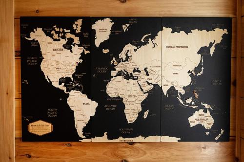 a black and white map of the world on a wall at Tri-Lake Escape in Naples