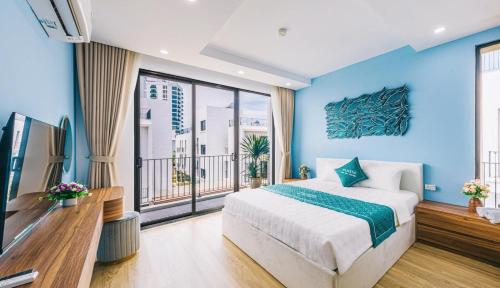 a blue bedroom with a bed and a large window at Moonlight Villa Vlasta Sam Son in Thanh Hóa
