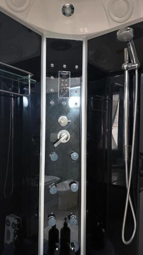a bathroom with a shower and a sink at Secret Place Central in Udine