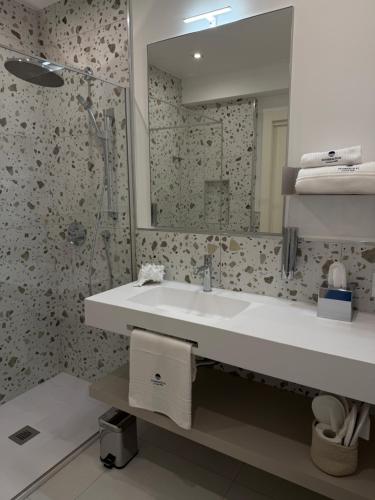 a bathroom with a sink and a mirror at SunBeach 44 - Skyview B&B in Melito di Porto Salvo