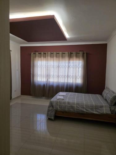 Ένα ή περισσότερα κρεβάτια σε δωμάτιο στο Chila Villa