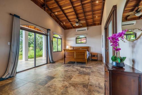 a home office with a desk and a room with windows at Getaway & Ocean Breeze - Secluded & Natural Charming - 2 bedrooms in Barú