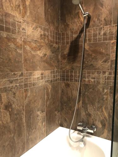 a bathroom with a shower with a sink at Apartment Galia Mohammedia in Mohammedia
