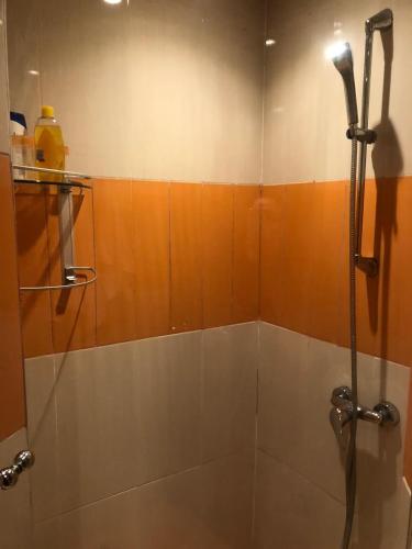 a bathroom with a shower with a glass door at Apartment Galia Mohammedia in Mohammedia
